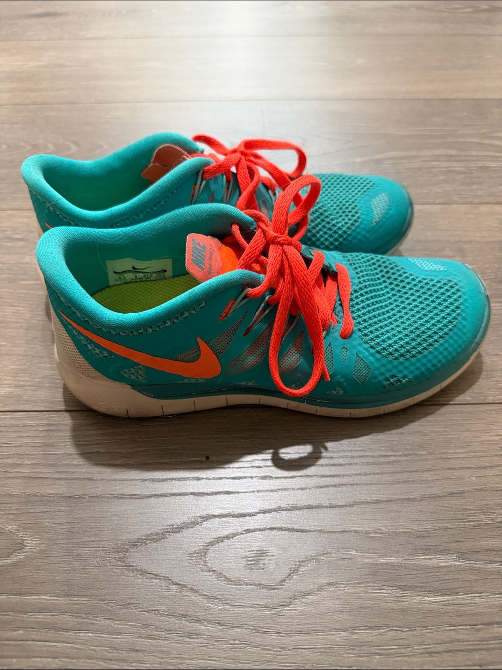 Nike Free Teal Sneakers with Bright Orange Accents